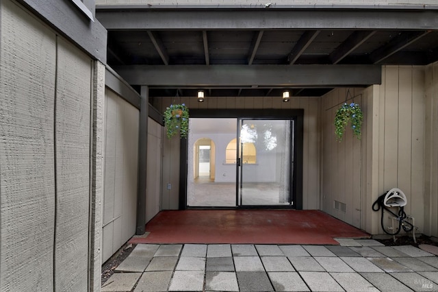 property entrance with a patio area