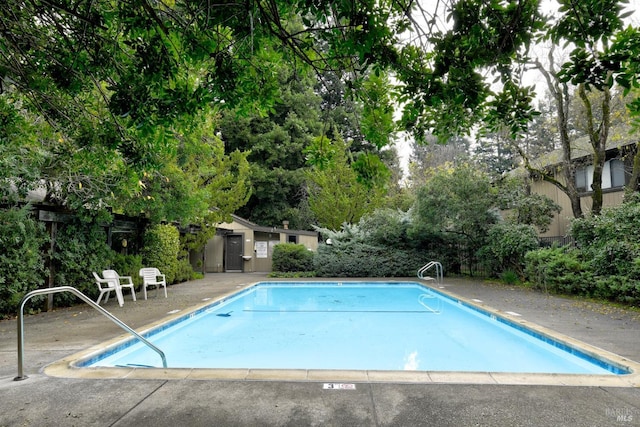 view of swimming pool with a patio area