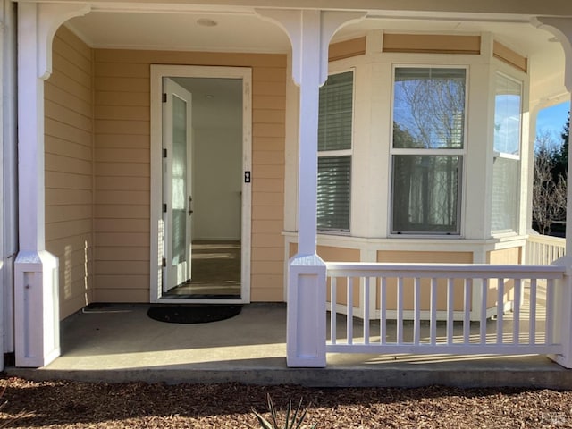 doorway to property featuring a porch