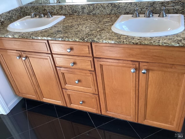 bathroom featuring tile patterned flooring and vanity