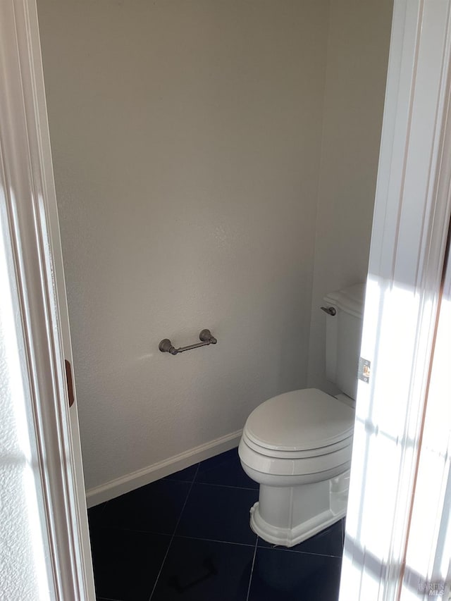 bathroom with tile patterned floors and toilet