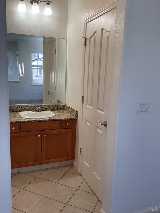 bathroom with tile patterned flooring and vanity