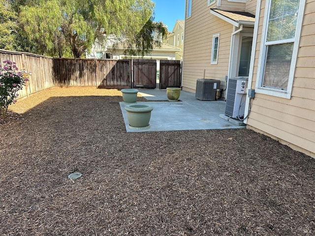 view of yard with a patio area and central AC unit