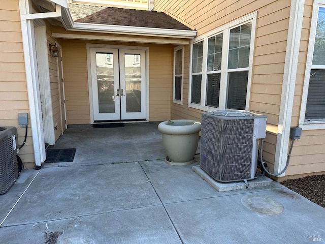 view of patio featuring central AC and french doors