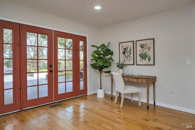 entryway with french doors, light hardwood / wood-style flooring, and a wealth of natural light