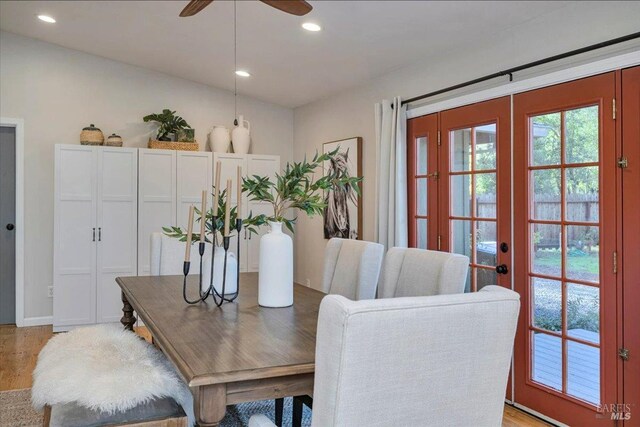 dining space featuring ceiling fan, light hardwood / wood-style floors, and french doors