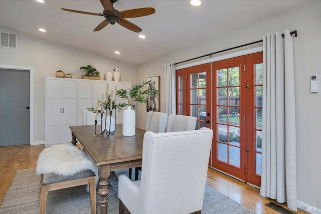 dining space featuring french doors, light hardwood / wood-style flooring, ceiling fan, and lofted ceiling