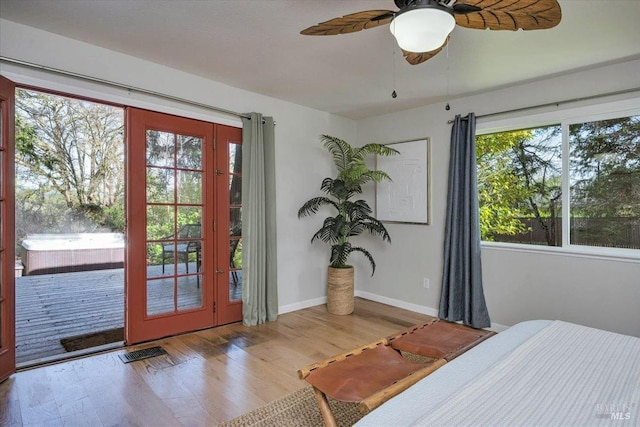 bedroom with access to outside, ceiling fan, and light hardwood / wood-style floors