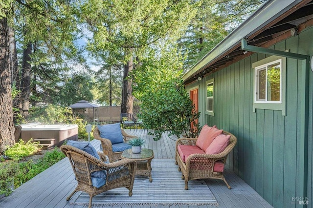 wooden deck featuring an outdoor living space and a hot tub