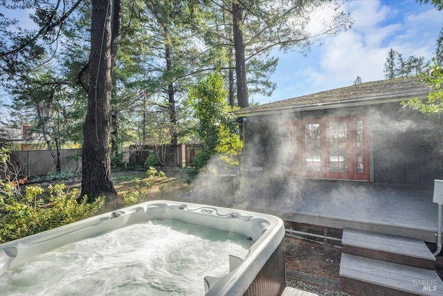 view of pool featuring a hot tub