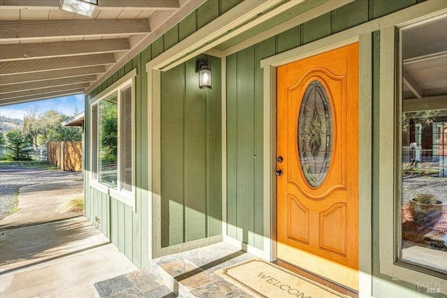 doorway to property featuring a porch