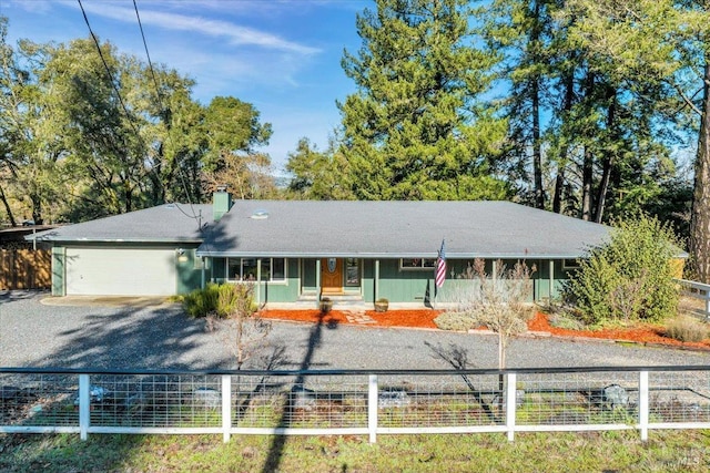 single story home featuring a garage