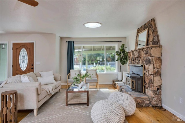 living room featuring a textured ceiling and hardwood / wood-style flooring