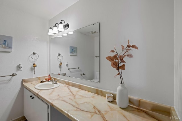 bathroom with vanity and visible vents