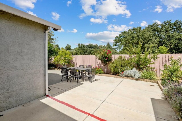 view of patio / terrace with a fenced backyard and outdoor dining area