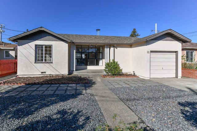 ranch-style house featuring a garage