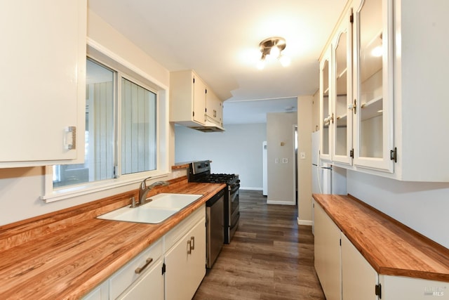 kitchen featuring sink, white cabinetry, dark hardwood / wood-style flooring, and stainless steel appliances