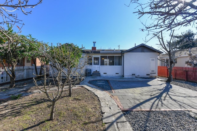 rear view of house featuring central air condition unit and a patio