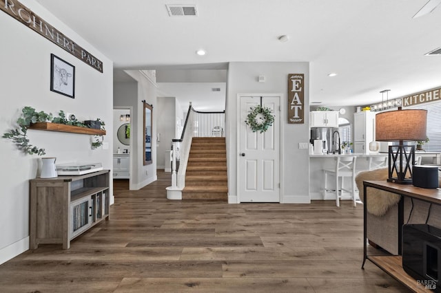 foyer with dark hardwood / wood-style flooring