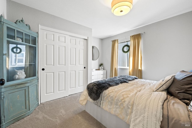 carpeted bedroom featuring a closet