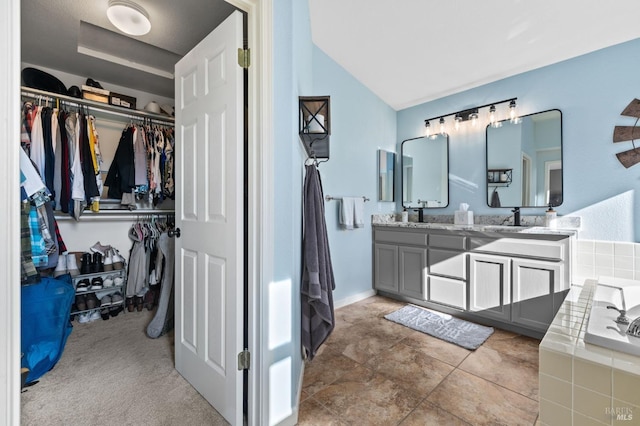 bathroom featuring vanity and a bathing tub