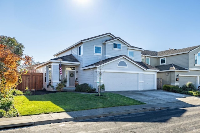 front of property with a garage and a front lawn