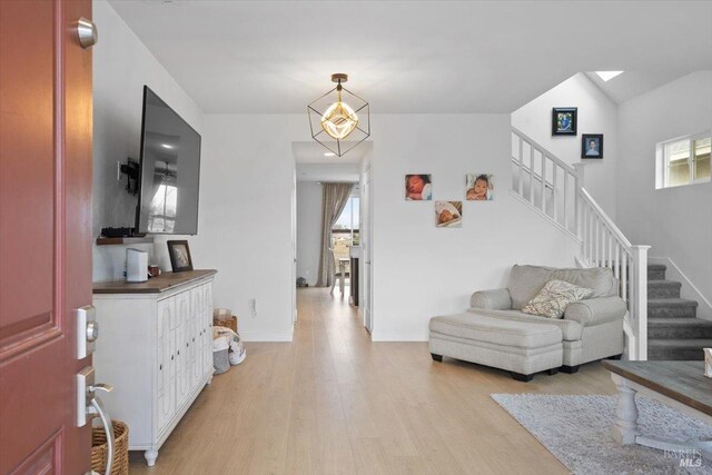 foyer entrance featuring light hardwood / wood-style flooring and a wealth of natural light