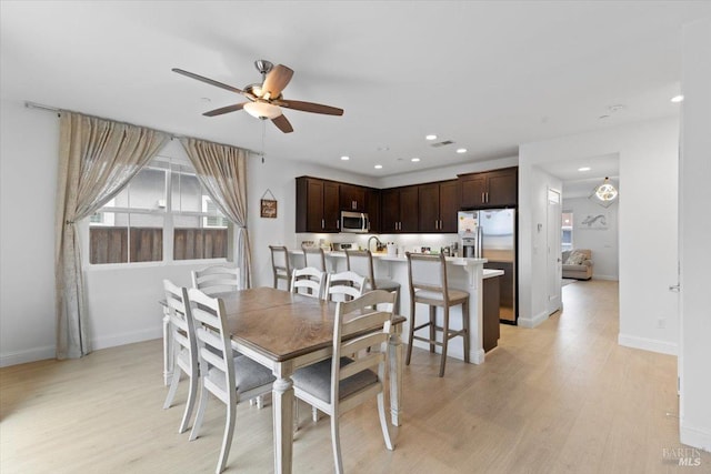 dining room with ceiling fan, light wood-style flooring, and recessed lighting