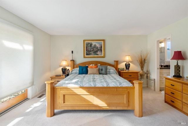 bedroom featuring light colored carpet