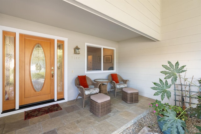 entrance to property featuring covered porch