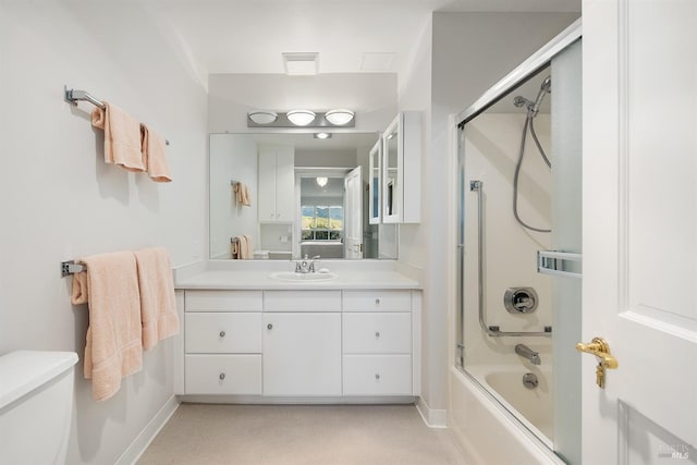 full bathroom with bath / shower combo with glass door, vanity, and toilet