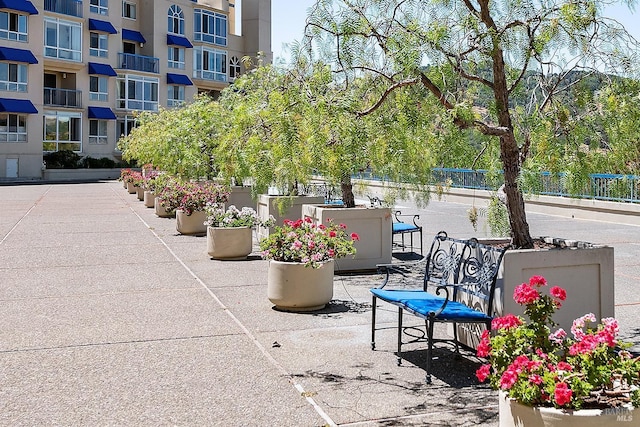 view of property's community featuring a patio area