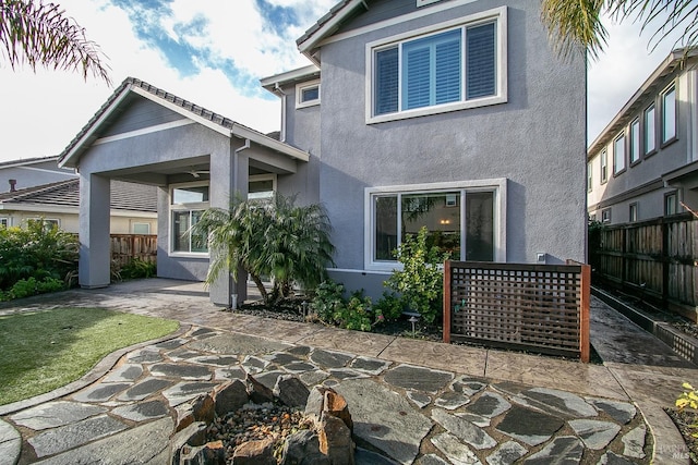 rear view of house featuring a patio