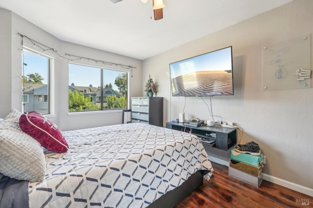 bedroom featuring ceiling fan and dark hardwood / wood-style floors