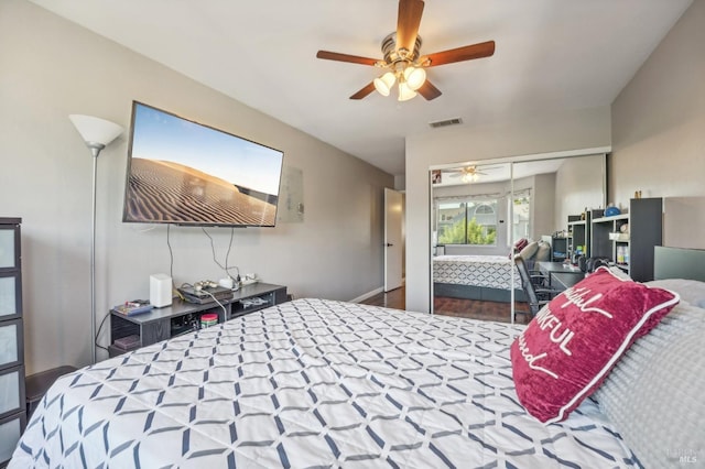 bedroom with ceiling fan and a closet