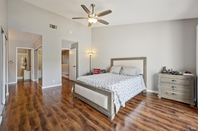 bedroom with dark hardwood / wood-style flooring, lofted ceiling, and ceiling fan