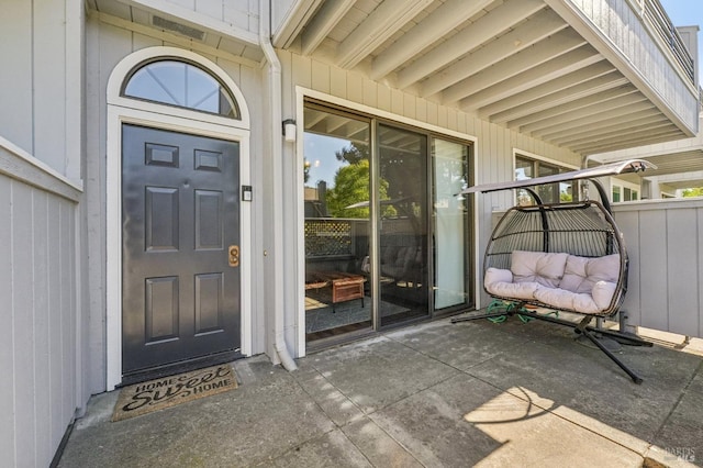 property entrance with a patio area