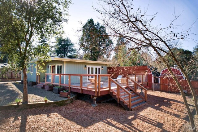 wooden deck with an outdoor living space