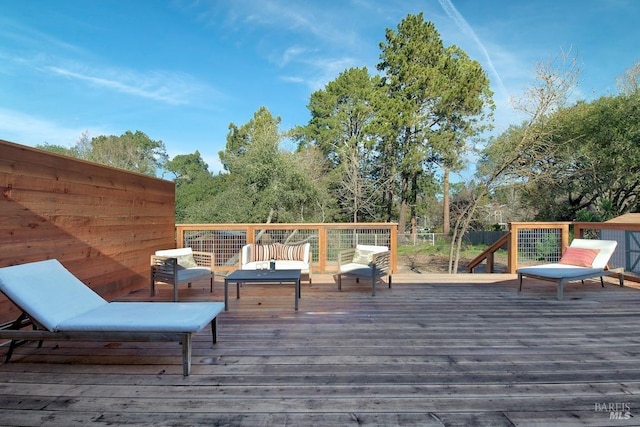 wooden terrace featuring an outdoor hangout area