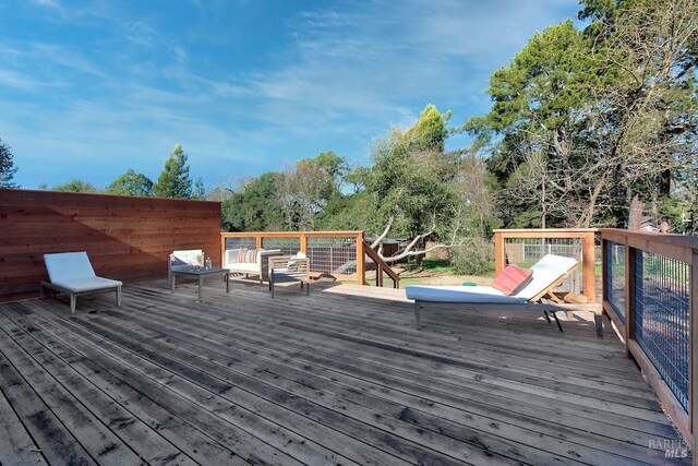 deck with an outdoor hangout area and french doors