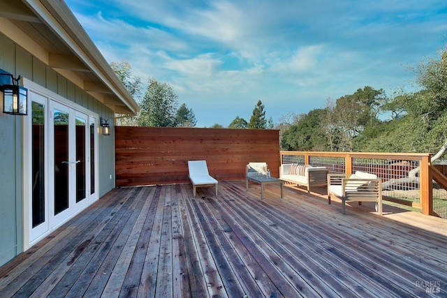 wooden deck featuring french doors