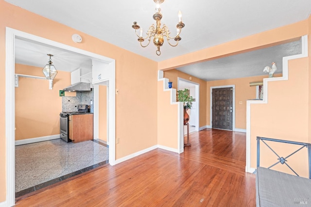 unfurnished dining area with a chandelier