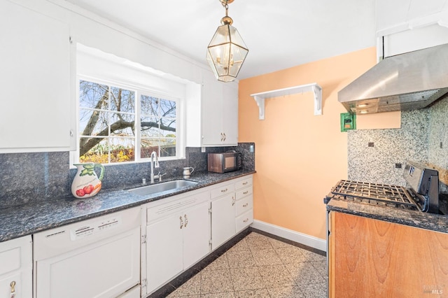 kitchen featuring baseboards, granite finish floor, a sink, under cabinet range hood, and white cabinetry