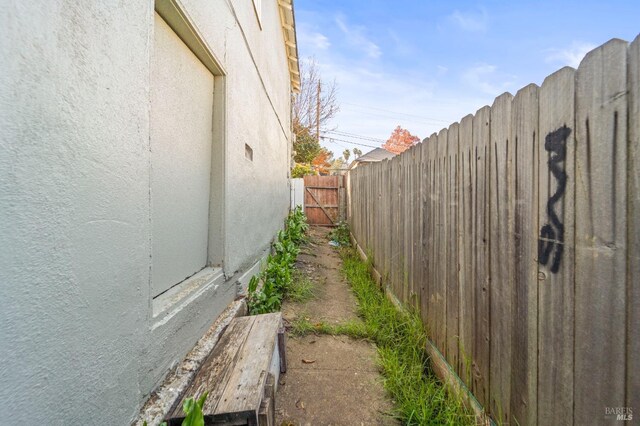 view of home's exterior with a fenced backyard and stucco siding