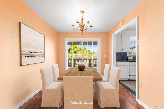 dining room with baseboards, an inviting chandelier, and dark wood-style flooring