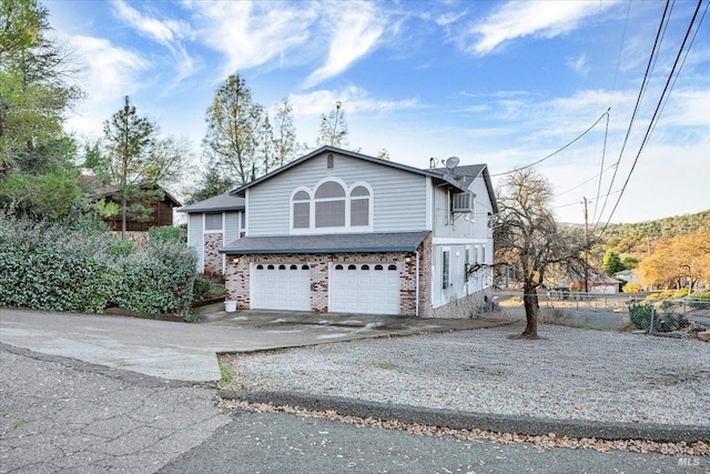 view of side of property featuring a garage