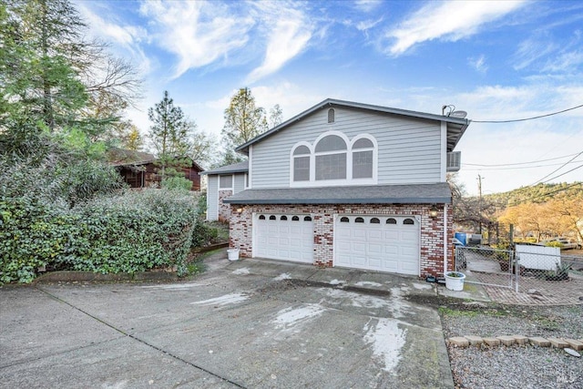 view of side of home with a garage