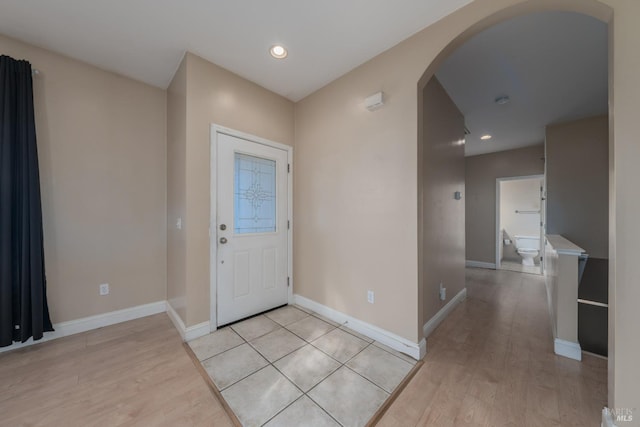 foyer entrance with light hardwood / wood-style flooring