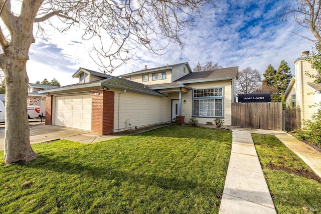 view of front of property with a garage and a front yard