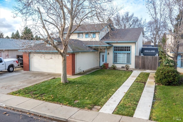 view of front of property featuring a garage and a front yard